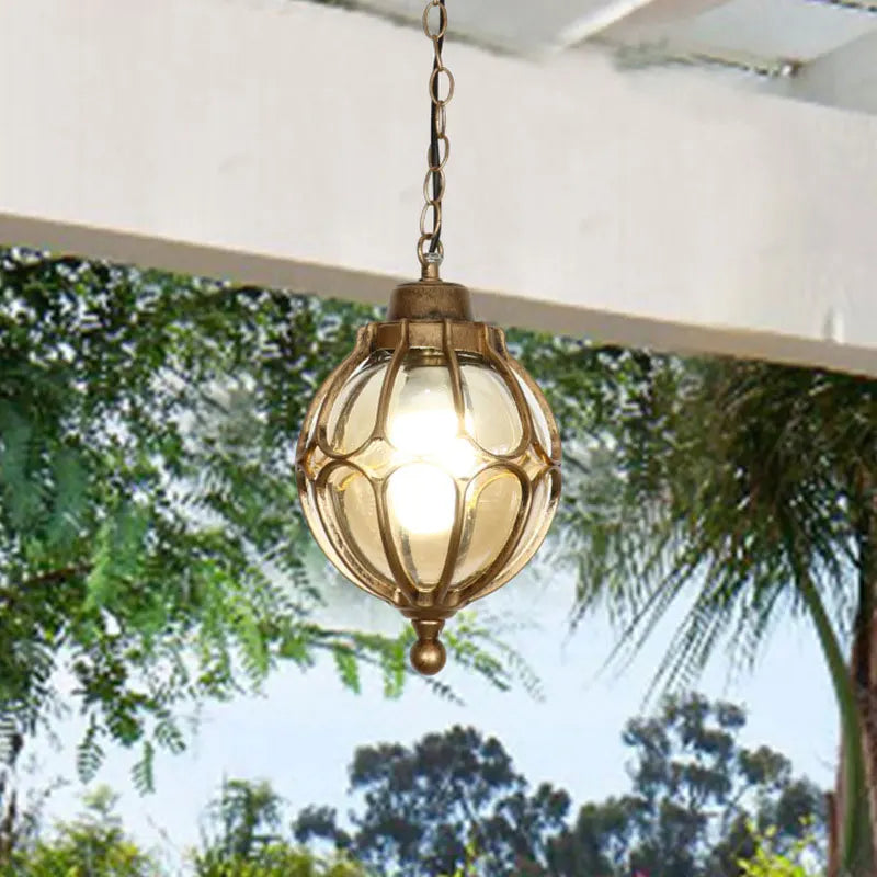 Lanterne Pergola Héléa en verre cerclé de métal bronze, suspendue à une chaîne